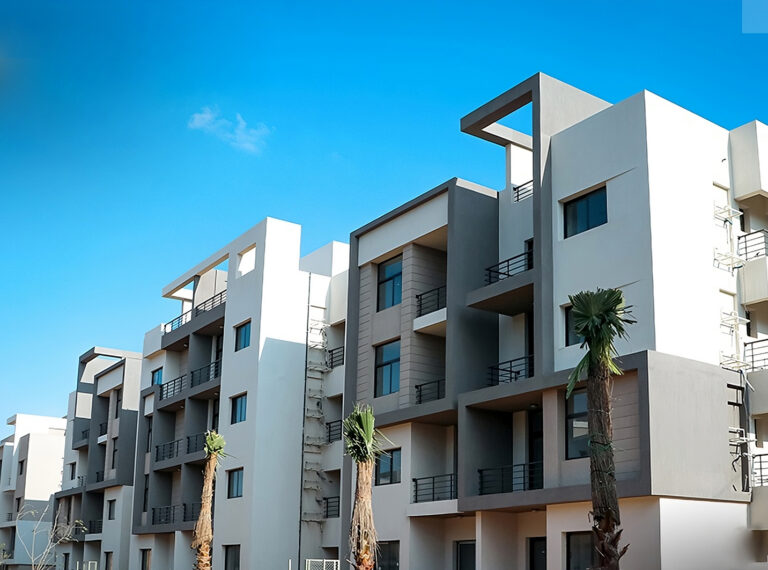 White and grey apartment building with balconies at 5th Square, Fifth Settlement