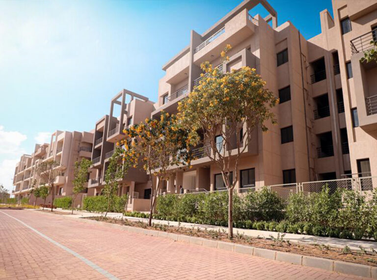 Paved walkway running alongside apartment buildings at 5th Square, Fifth Settlement
